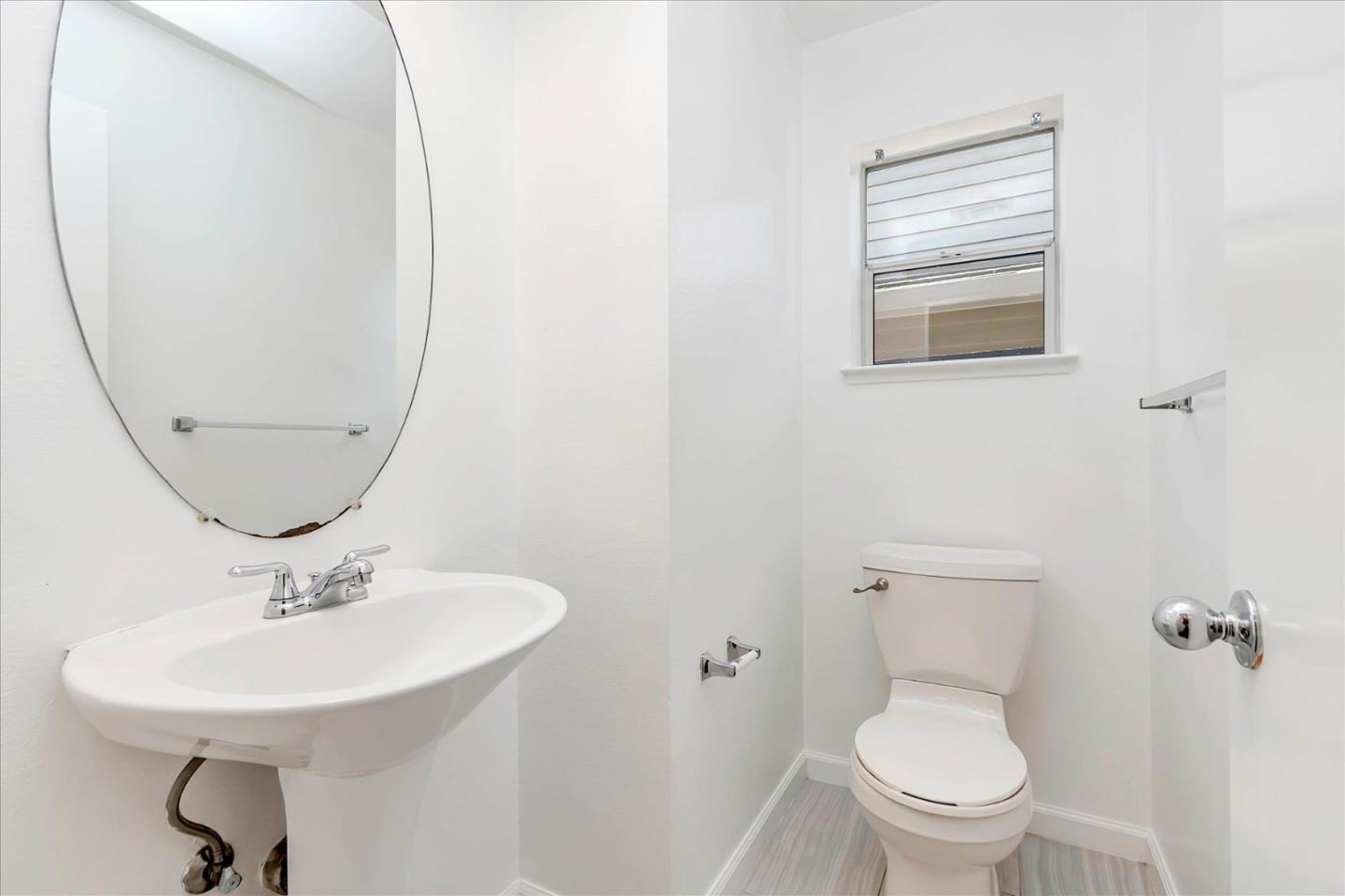 1483 Chavez Way San Jose, CA 95131 - Photo 7 of 40 a bathroom with a toilet a sink and a mirror