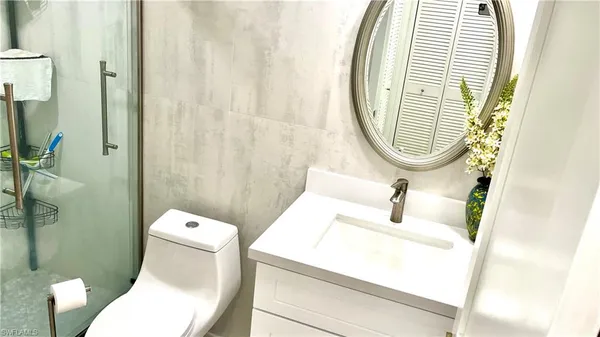 a bathroom with a toilet and a sink