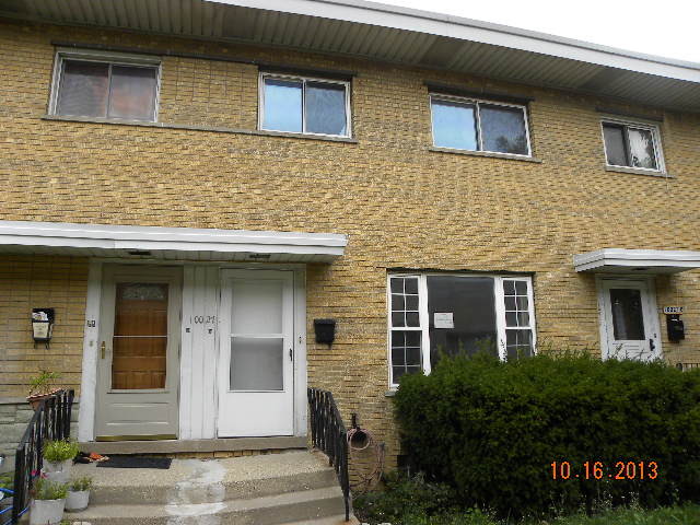 10027 Frontage Road, Unit F Skokie, IL 60077 - Photo 1 of 13 a front view of a house with stairs