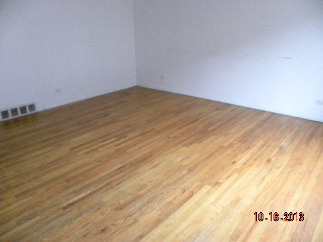10027 Frontage Road, Unit F Skokie, IL 60077 - Photo 2 of 13 a view of empty room with wooden floor