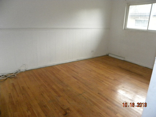 10027 Frontage Road, Unit F Skokie, IL 60077 - Photo 11 of 13 an empty room with a window