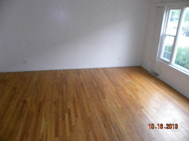 10027 Frontage Road, Unit F Skokie, IL 60077 - Photo 13 of 13 a view of an empty room and a window
