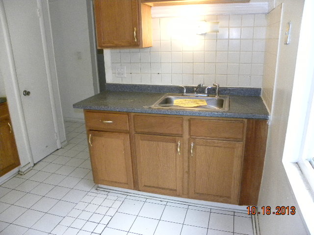 10027 Frontage Road, Unit F Skokie, IL 60077 - Photo 5 of 13 a bathroom with a sink and a shower