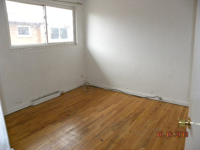 10027 Frontage Road, Unit F Skokie, IL 60077 - Photo 9 of 13 an empty room with a window