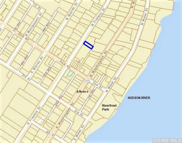 a room with a white walls and a shower curtain