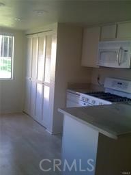 795 Daffodil Drive Riverside, CA 92507 - Photo 5 of 9 a kitchen with a sink and a window