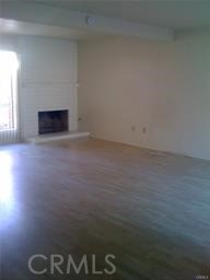 795 Daffodil Drive Riverside, CA 92507 - Photo 8 of 9 a view of empty room with a fireplace