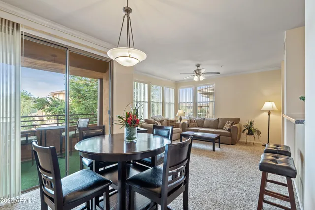 a view of a dining area with furniture and chandelier