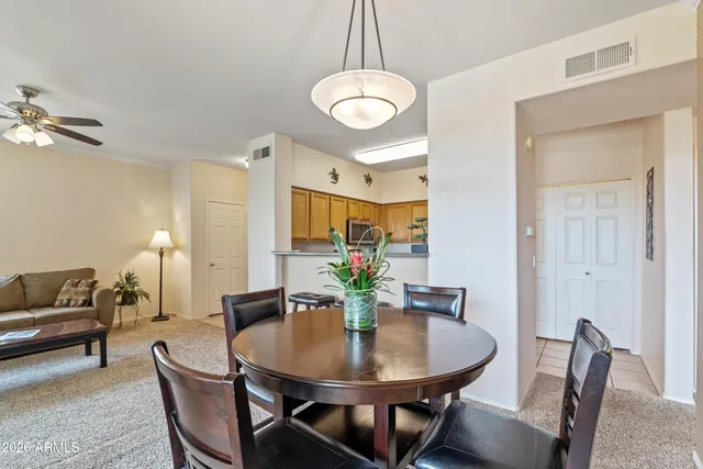 a view of a dining room with furniture window and outside view