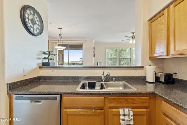 a kitchen with a sink stove and microwave