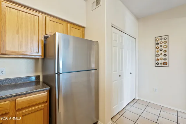a view of a kitchen with a sink and a window