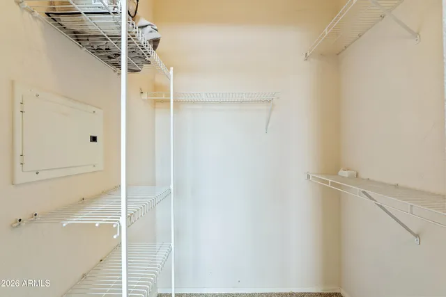 a bedroom with a bed and cabinets