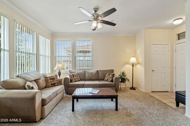 a living room with furniture and a large window