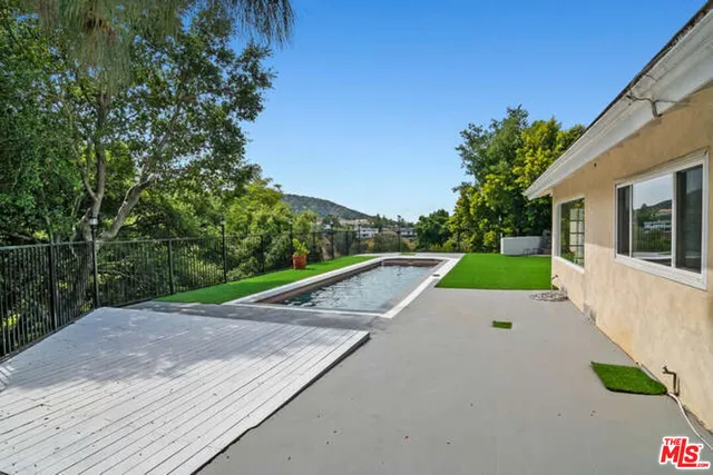 a view of a house with a back yard