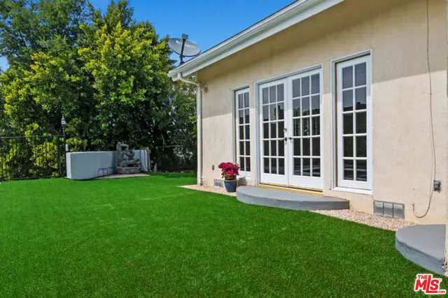 a view of a swimming pool with a yard
