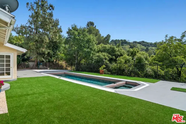 a view of a large building with a mountain in the background