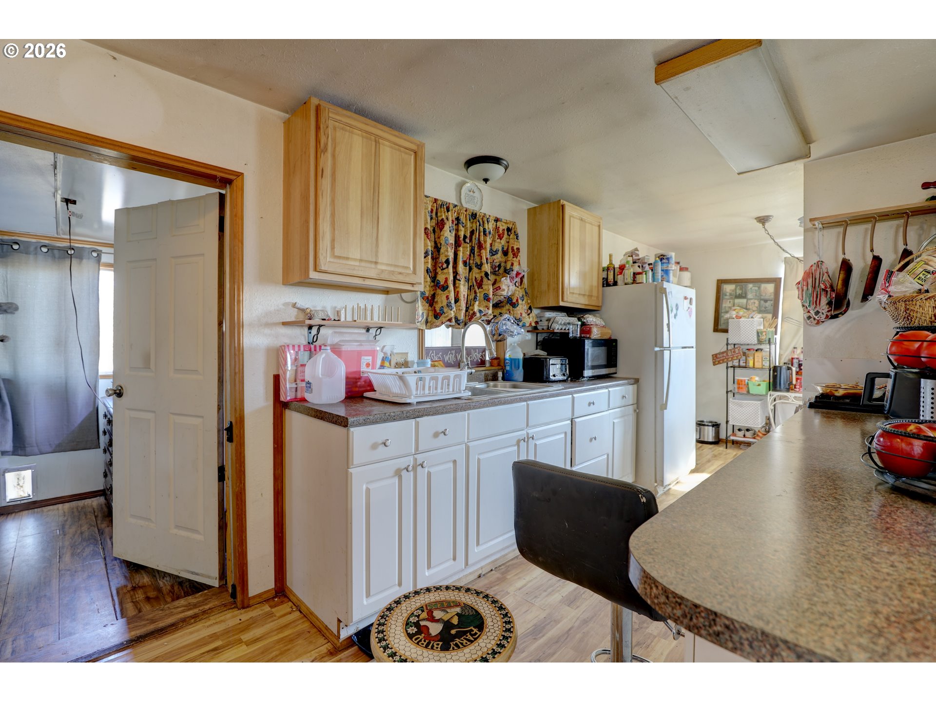 80165 Ridgetop Road Dufur, OR 97021 - Photo 14 of 43 a kitchen with stainless steel appliances granite countertop a refrigerator and a sink