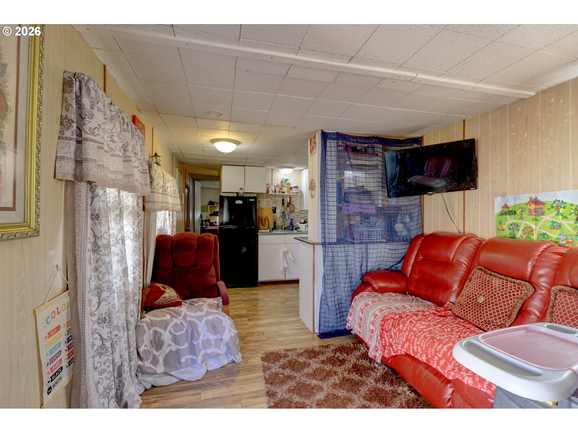 80165 Ridgetop Road Dufur, OR 97021 - Photo 27 of 43 a living room with furniture a couch and a flat screen tv