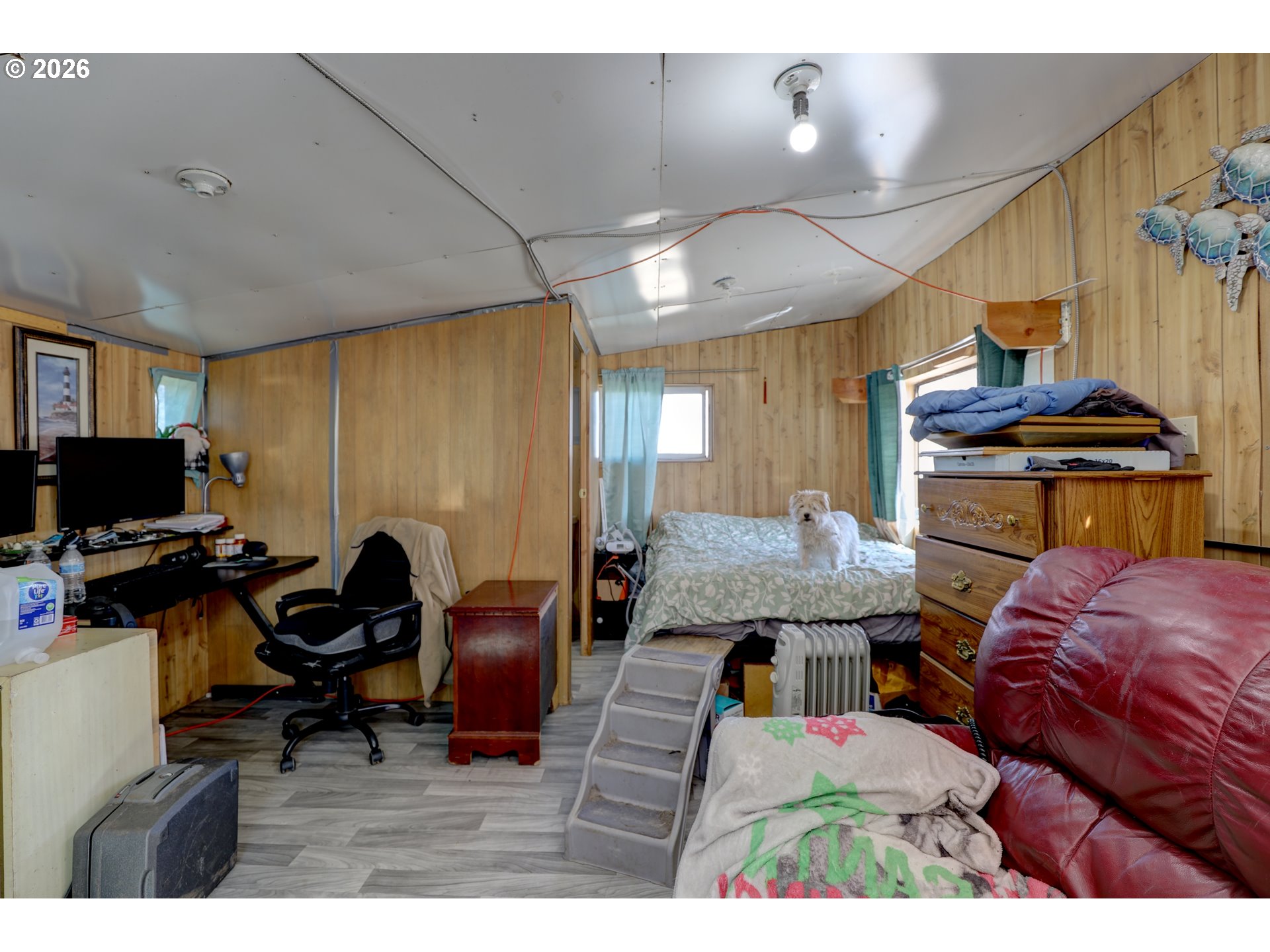 80165 Ridgetop Road Dufur, OR 97021 - Photo 28 of 43 a bedroom with furniture and a flat screen tv