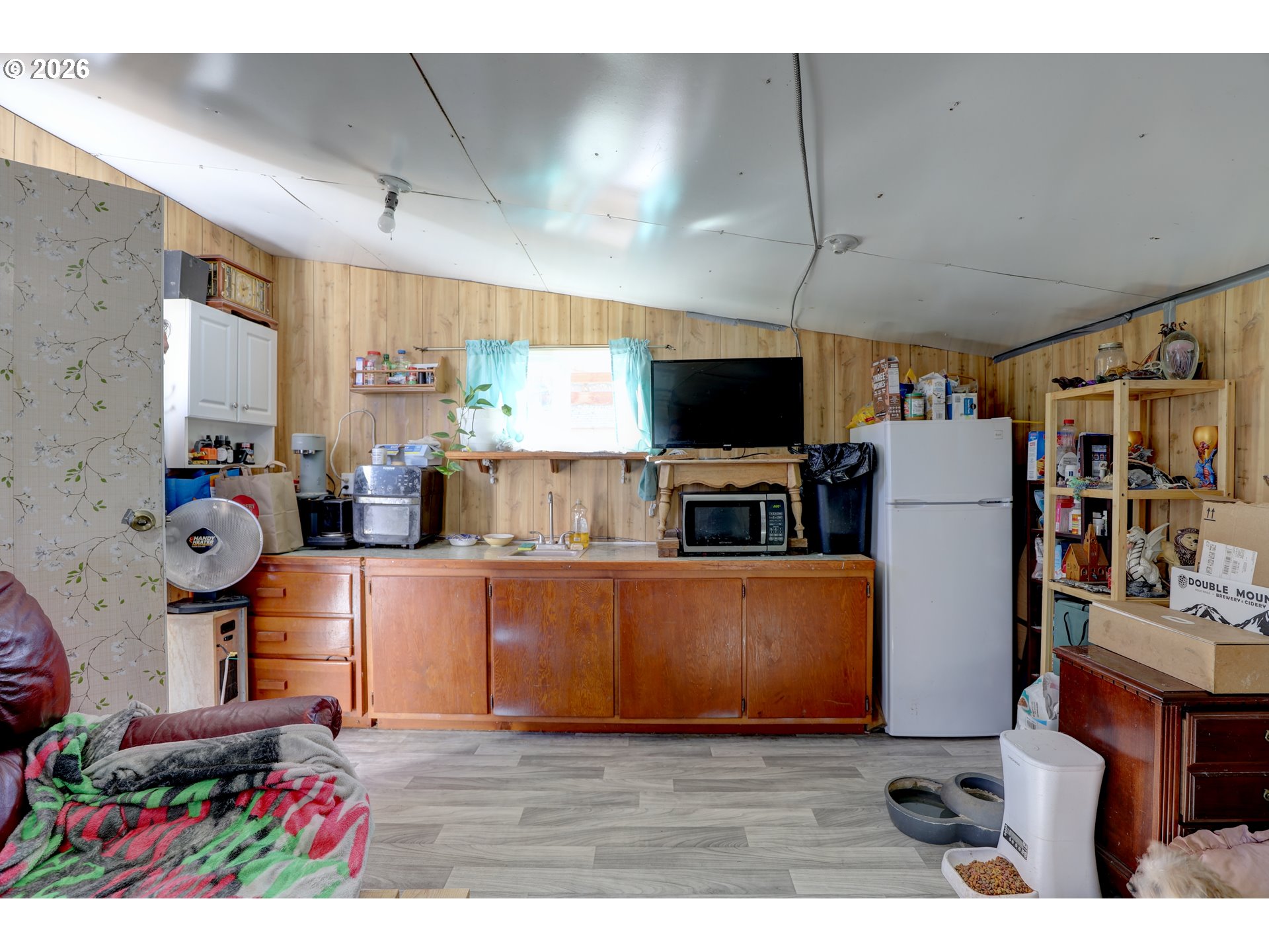 80165 Ridgetop Road Dufur, OR 97021 - Photo 29 of 43 a living room with furniture and a flat screen tv