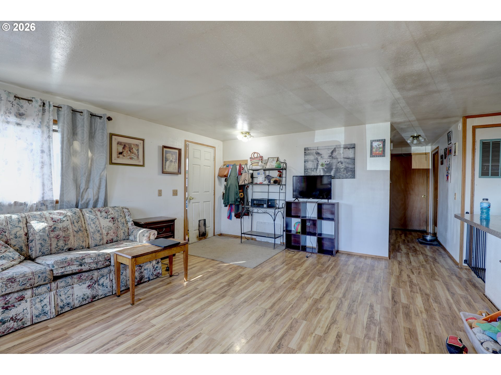 80165 Ridgetop Road Dufur, OR 97021 - Photo 6 of 43 a living room with furniture and a flat screen tv