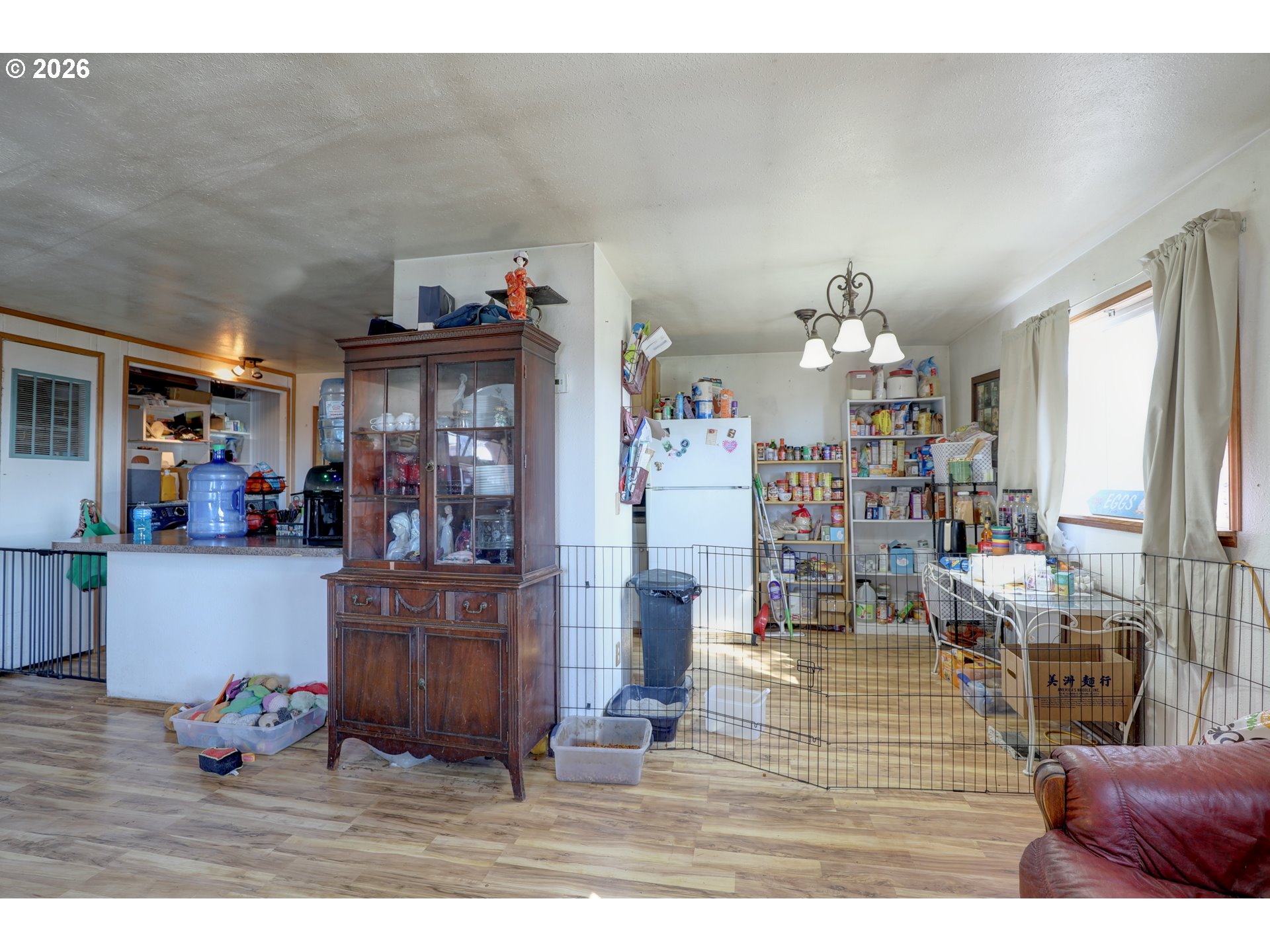 80165 Ridgetop Road Dufur, OR 97021 - Photo 8 of 43 a living room with furniture and a chandelier