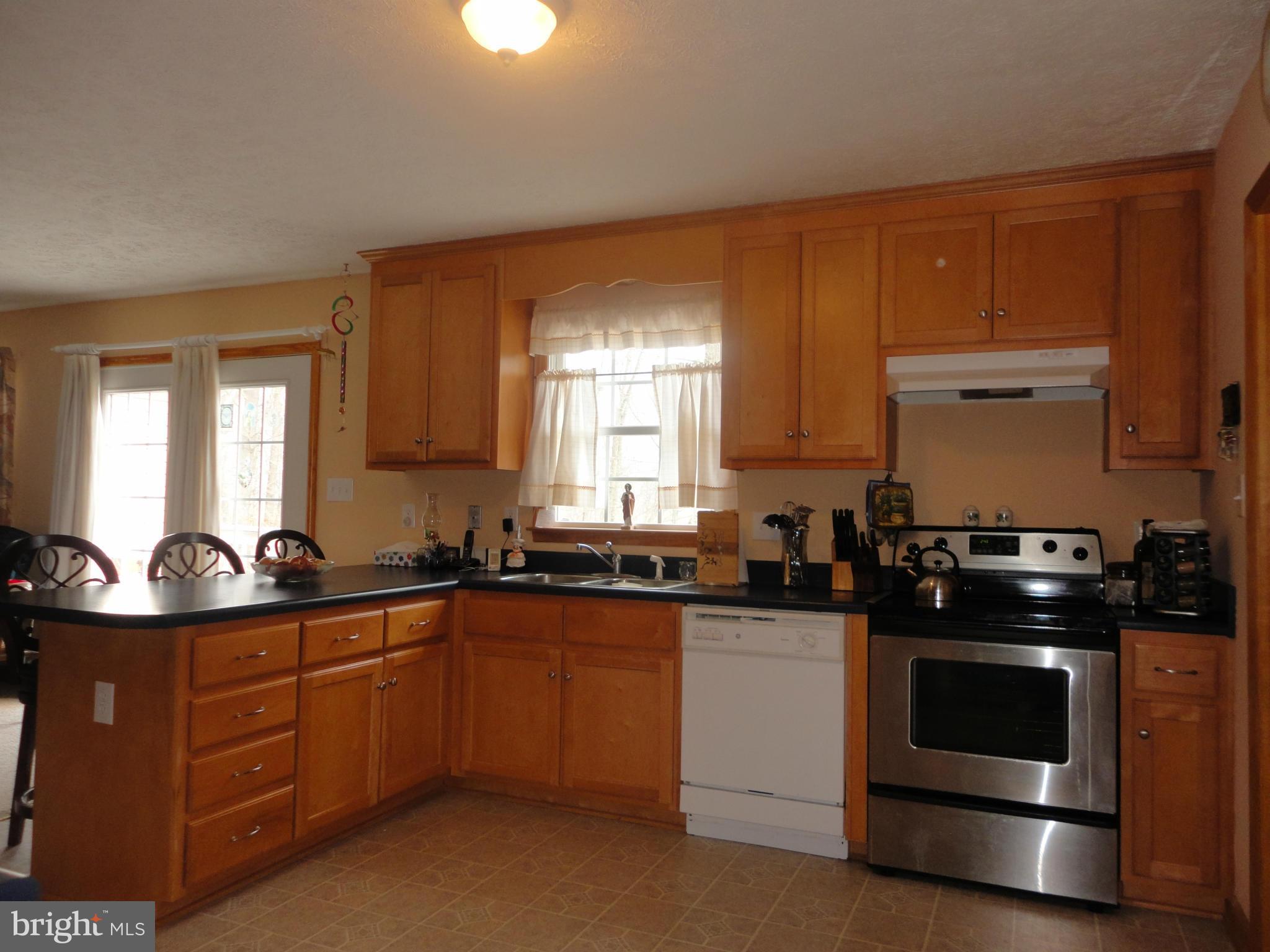 1339 Libby's Ridge Road Berkeley Springs, WV 25411 - Photo 19 of 25 Kitchen with overhang countertop