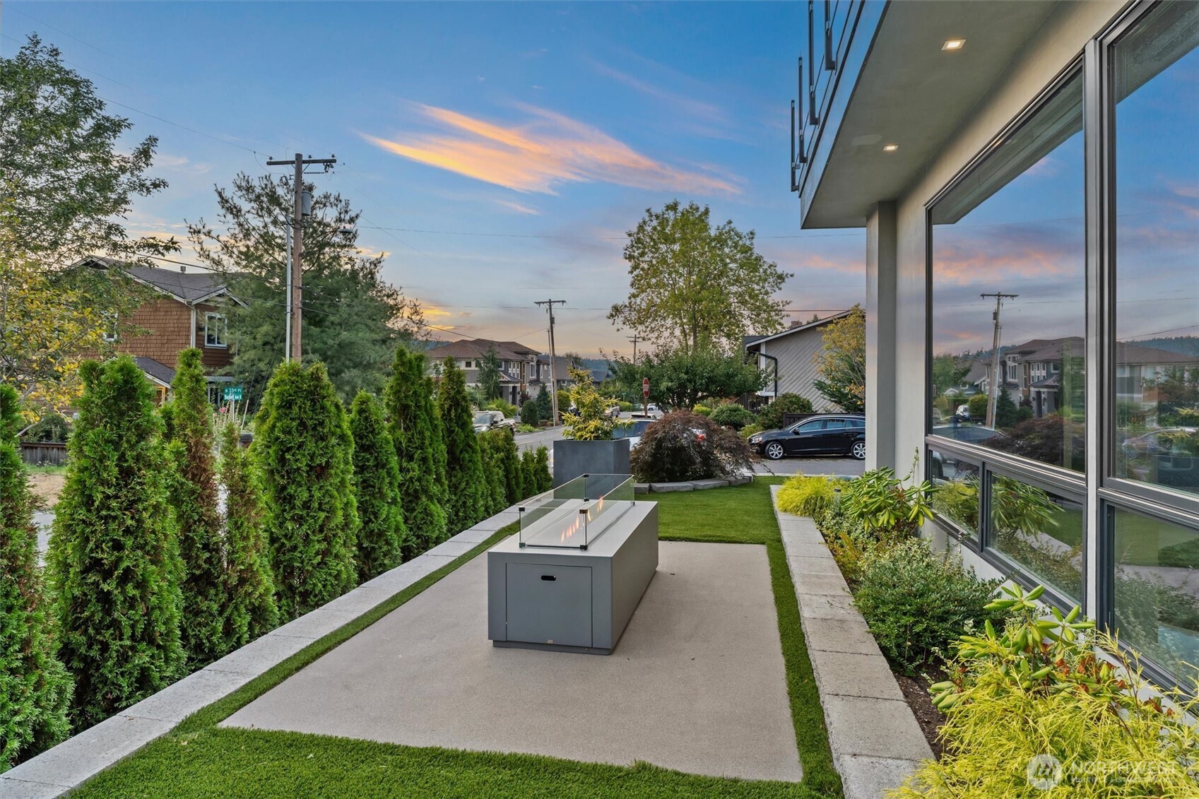 903 North 33rd Place Renton, WA 98056 - Photo 14 of 28 a view of a patio with plants and a garden