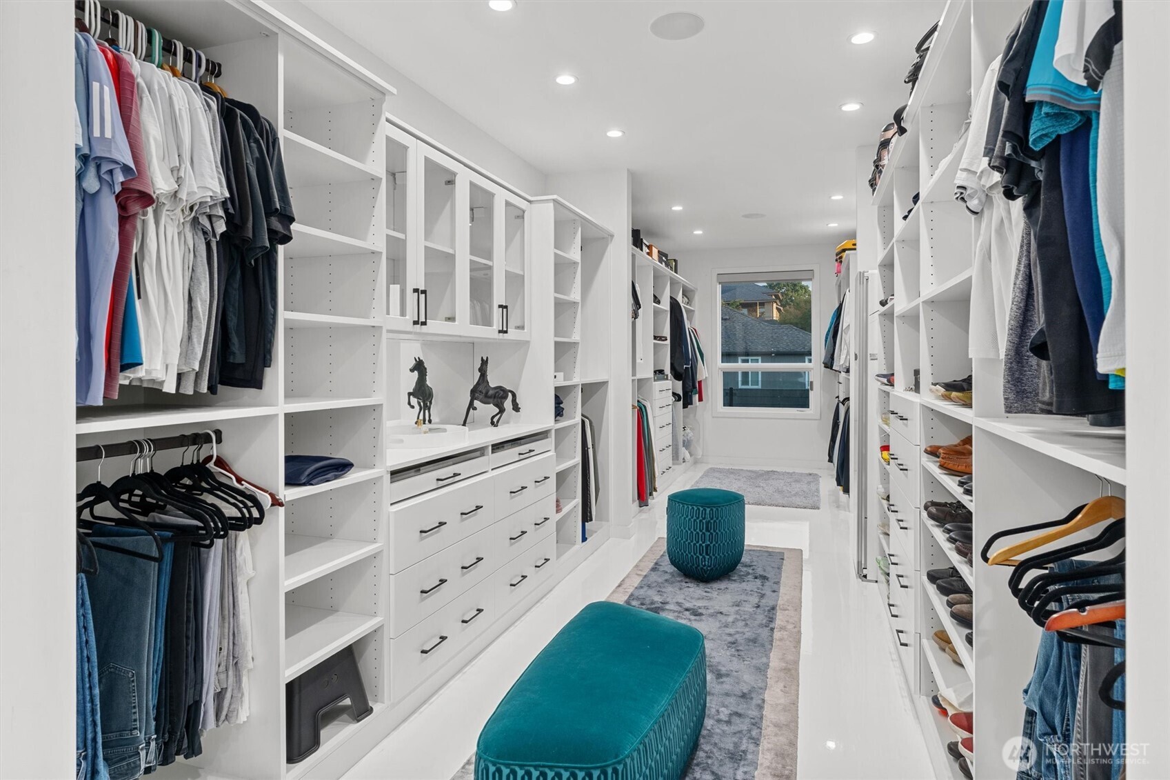 903 North 33rd Place Renton, WA 98056 - Photo 17 of 28 a view of walk in closet with clothes and shoes