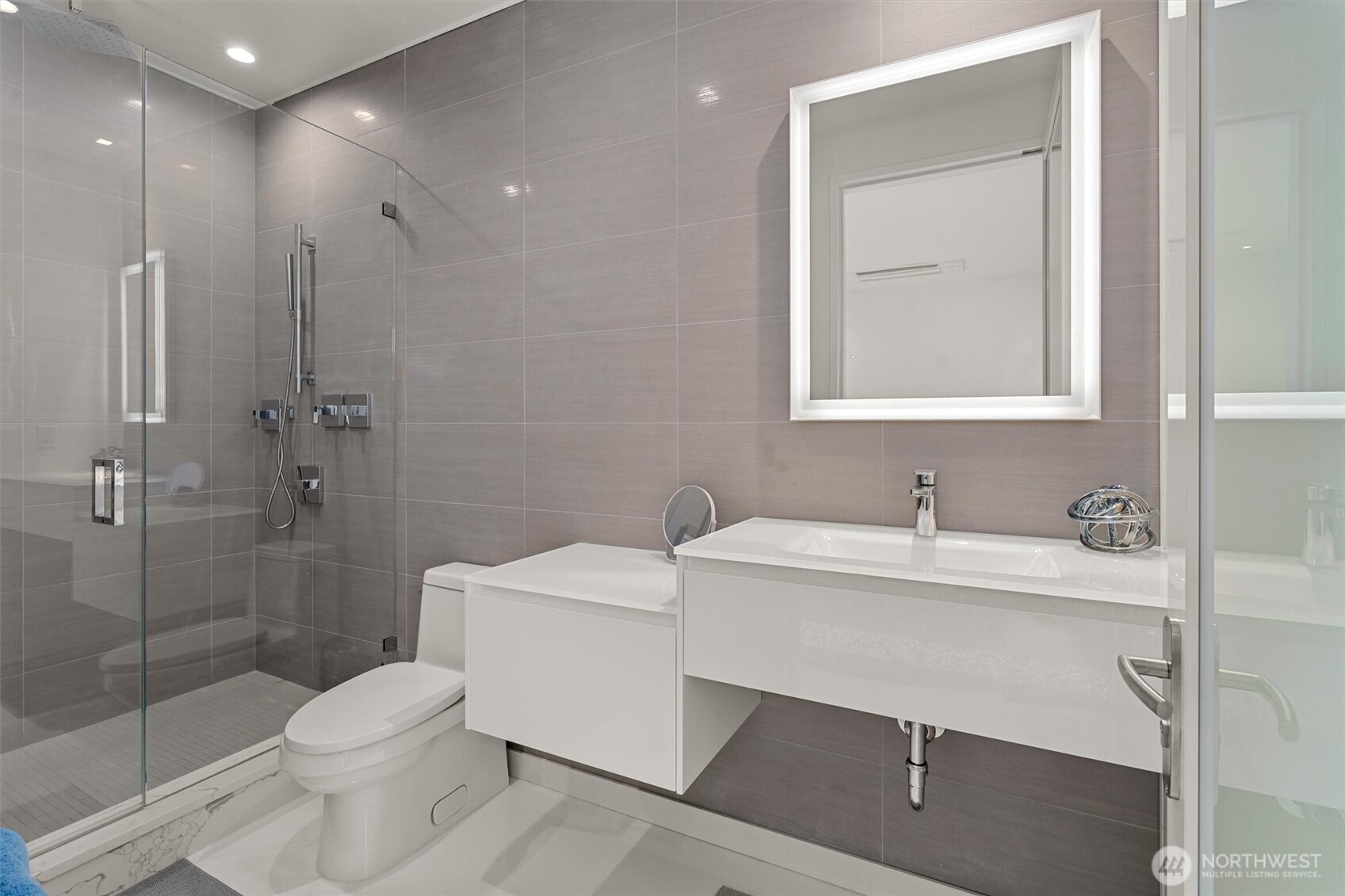 903 North 33rd Place Renton, WA 98056 - Photo 22 of 28 a bathroom with a toilet sink a shower and