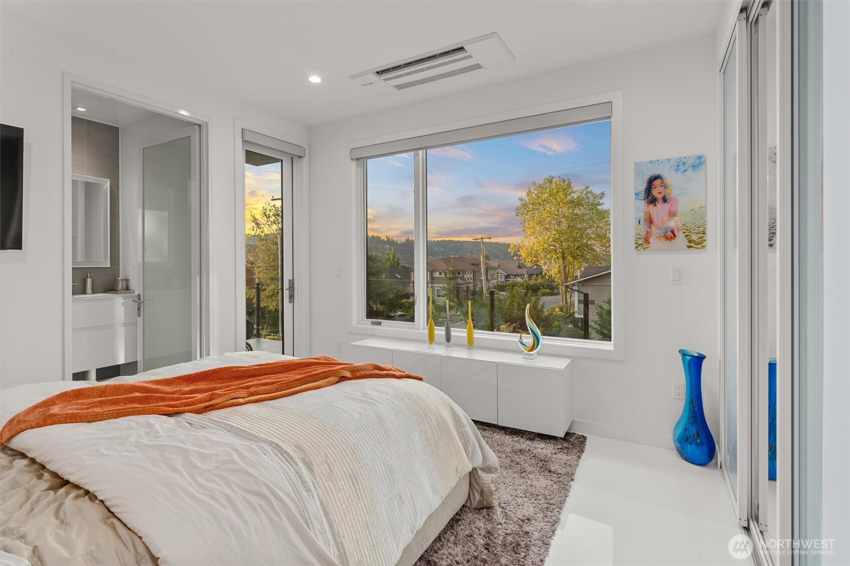 903 North 33rd Place Renton, WA 98056 - Photo 23 of 28 a bedroom with a bed and a large window