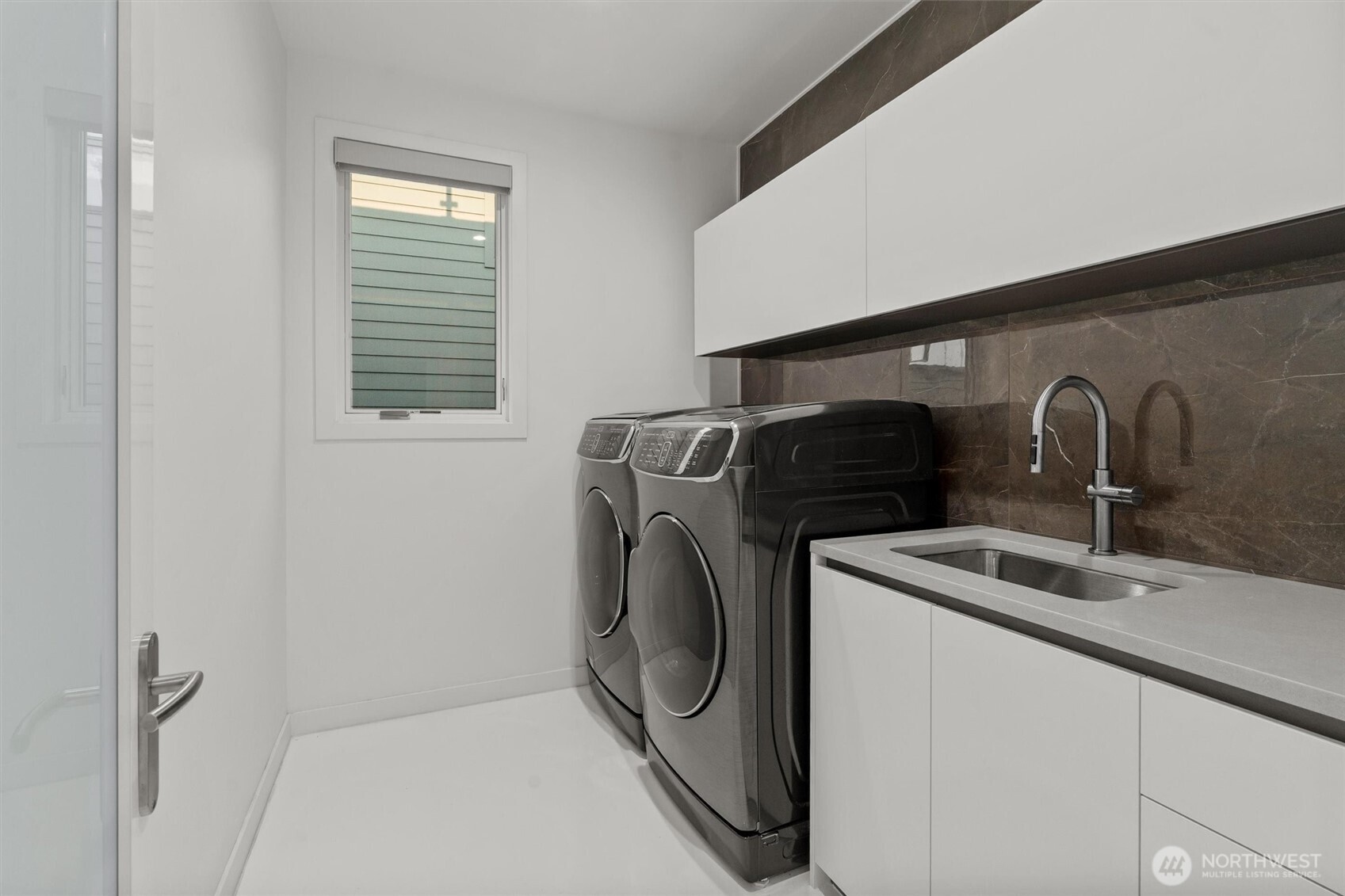 903 North 33rd Place Renton, WA 98056 - Photo 25 of 28 a utility room with sink dryer and washer