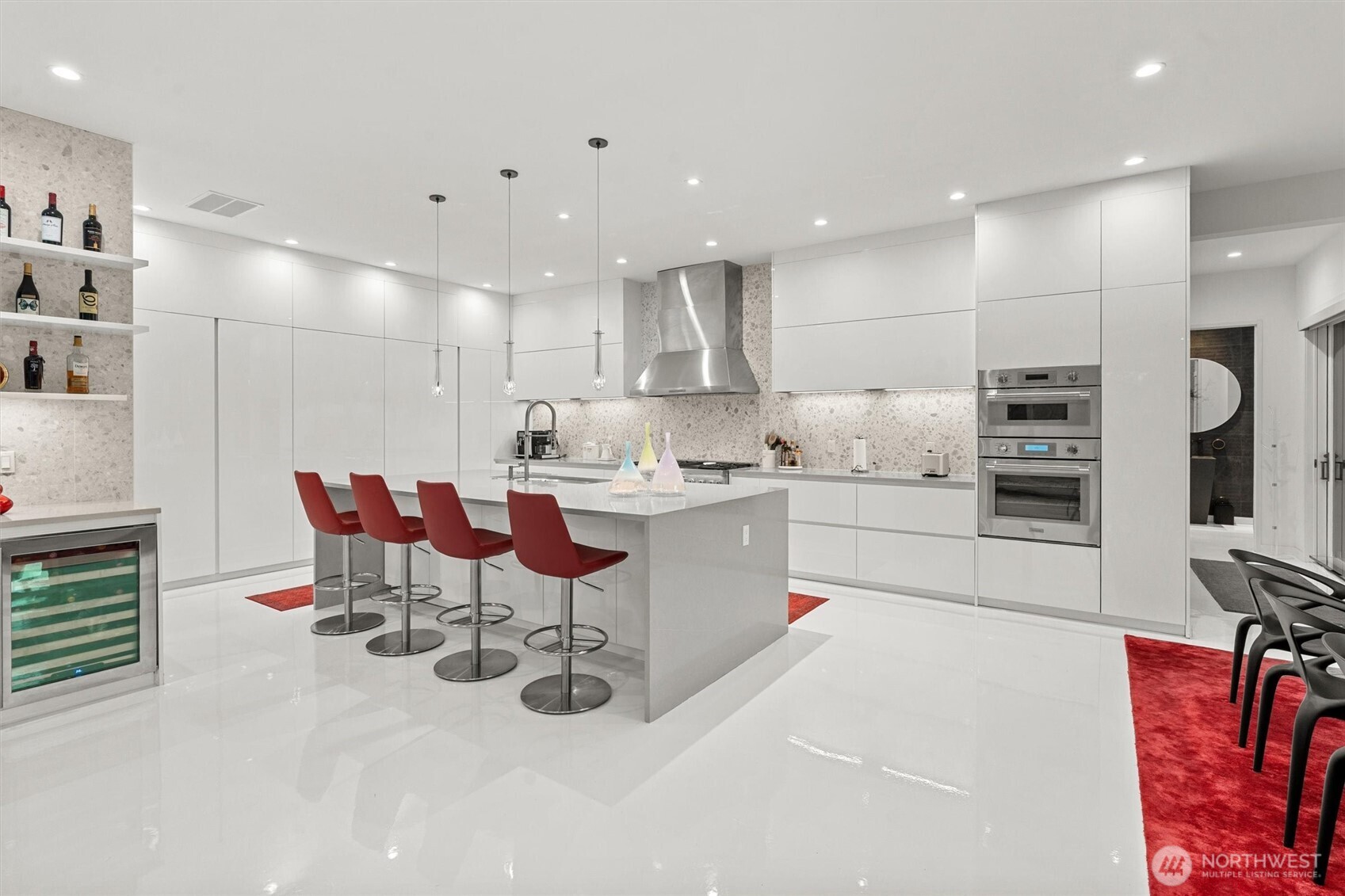 903 North 33rd Place Renton, WA 98056 - Photo 8 of 28 a kitchen with stainless steel appliances kitchen island granite countertop a sink and cabinets