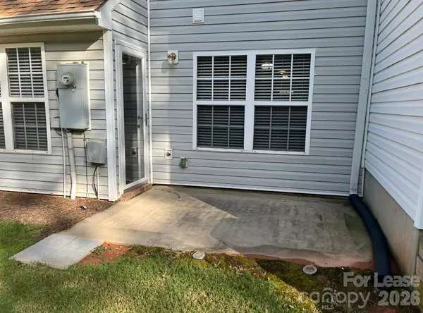 a view of house with backyard space and porch