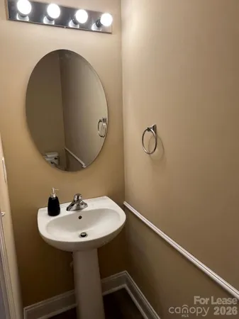 a bathroom with a sink and mirror