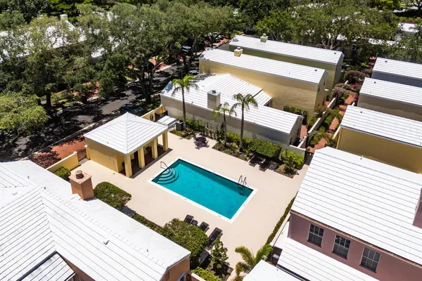 an aerial view of a house with backyard