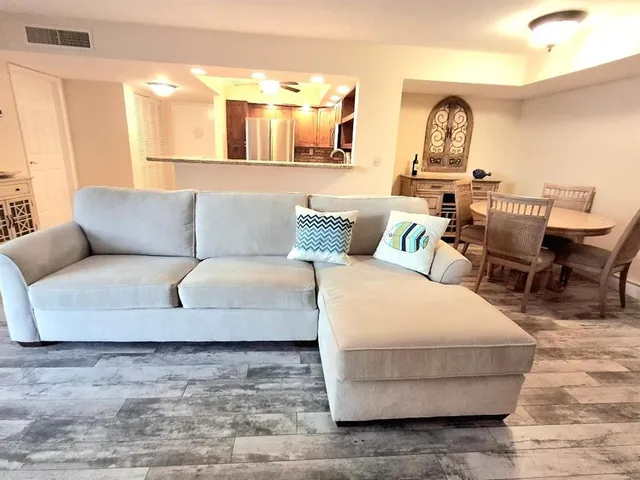 a living room with furniture and a couch