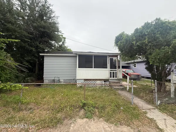 a house with trees in the background