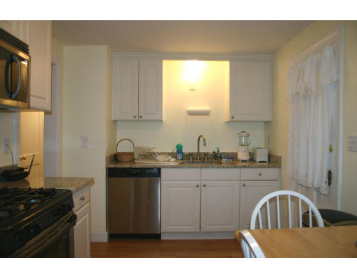 58 Felch Road Natick, MA 01760 - Photo 6 of 10 a kitchen with a sink a stove and cabinets