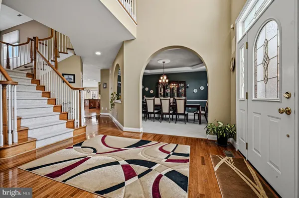 a view of a livingroom with furniture and a table wooden floor