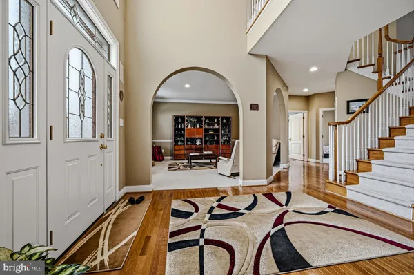 a living room with furniture a window and gym equipment