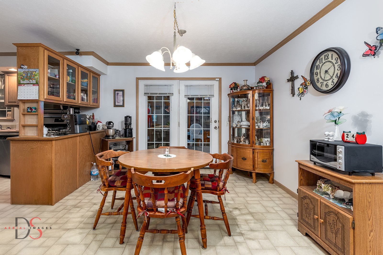 32415 North 600 E Road Streator, IL 61364 - Photo 11 of 44 a view of a dining room with furniture a chandelier and kitchen view