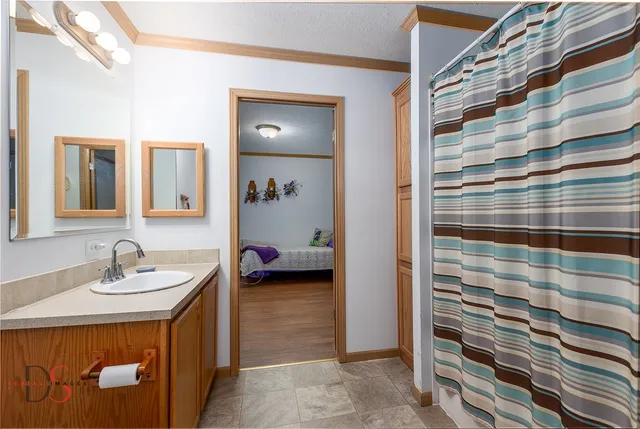 a bathroom with a sink and a mirror