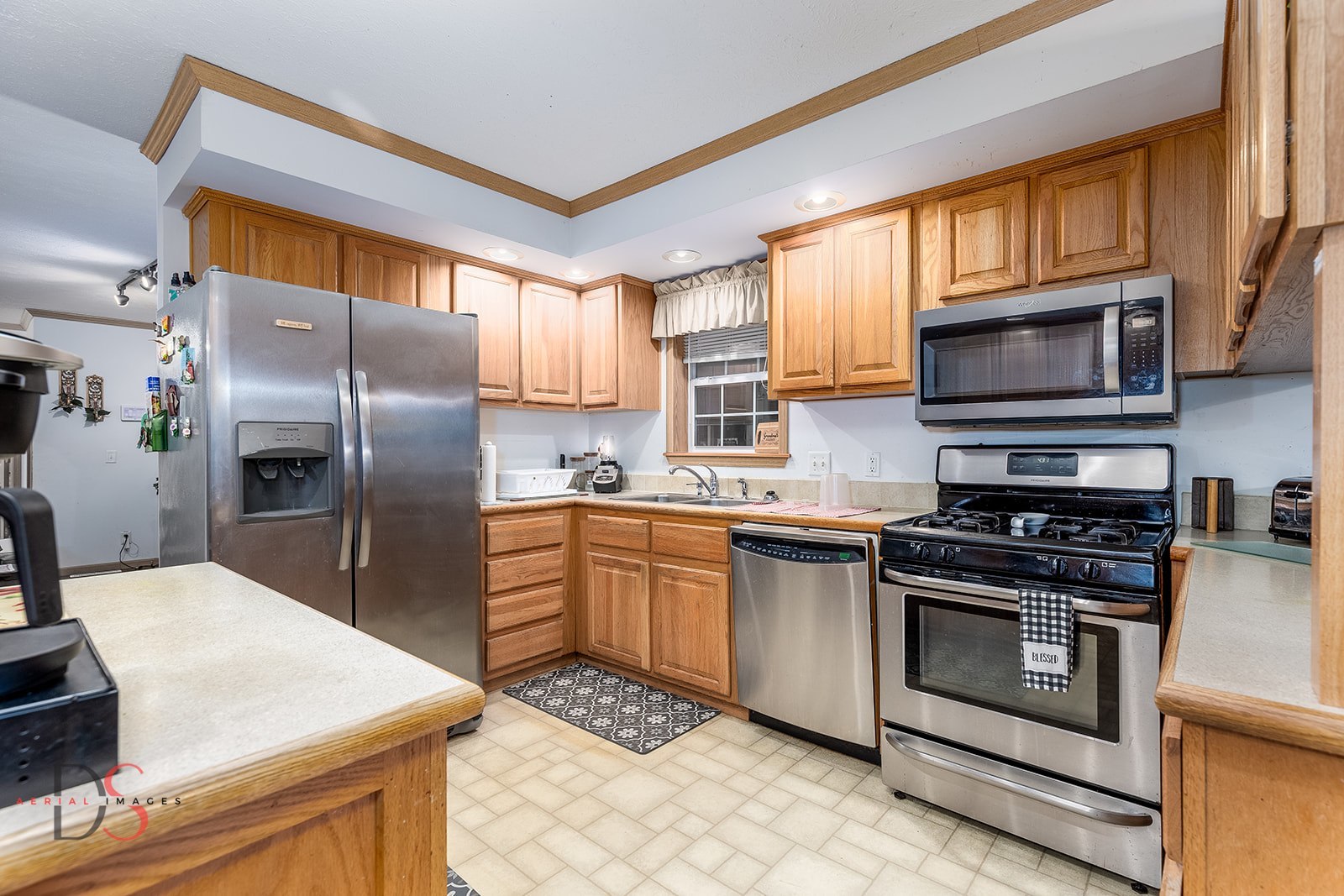 32415 North 600 E Road Streator, IL 61364 - Photo 9 of 44 a kitchen with a stove a sink and a microwave