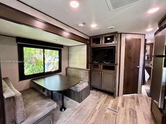 11310 Southwest 244th Terrace, Unit 11310 Homestead, FL 33032 - Photo 2 of 9 a kitchen with stainless steel appliances granite countertop a refrigerator a sink a stove and a refrigerator