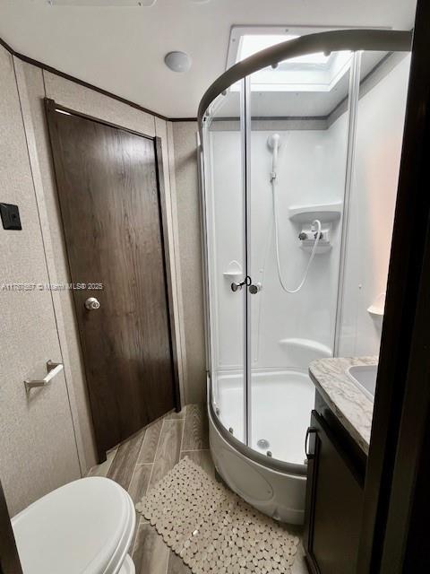 11310 Southwest 244th Terrace, Unit 11310 Homestead, FL 33032 - Photo 8 of 9 a bathroom with a granite countertop shower and a toilet