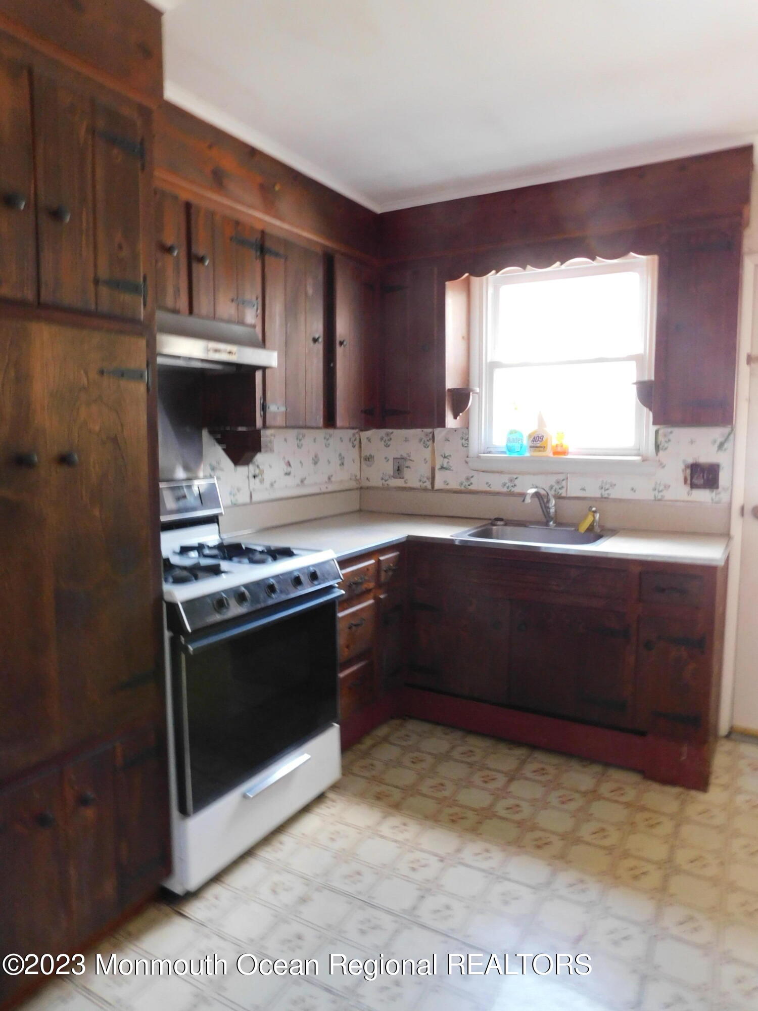 660 Pine Meadow Road Brick, NJ 08724 - Photo 15 of 67 a kitchen with stainless steel appliances granite countertop a sink stove and microwave