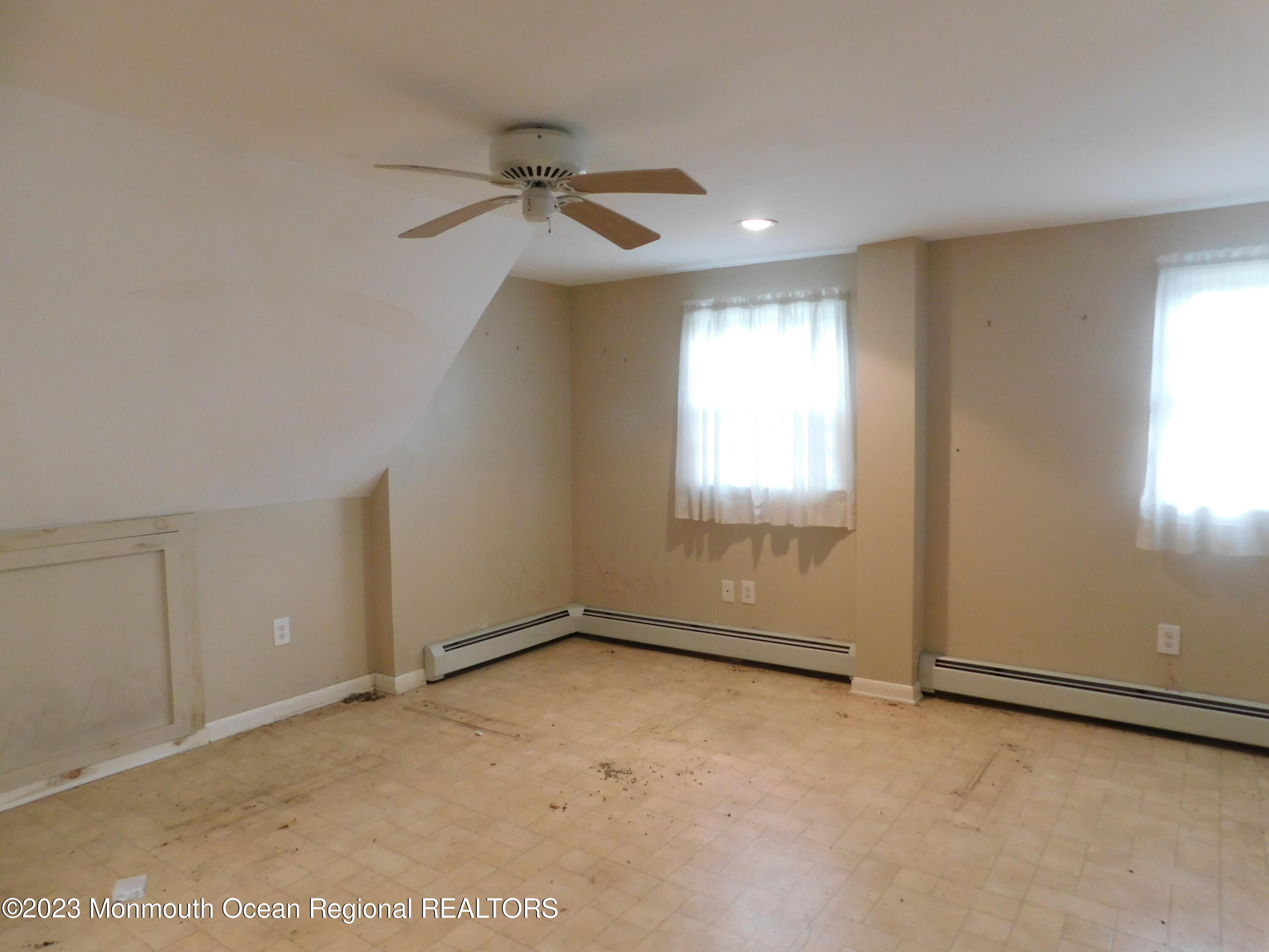 660 Pine Meadow Road Brick, NJ 08724 - Photo 18 of 67 an empty room with windows and fan