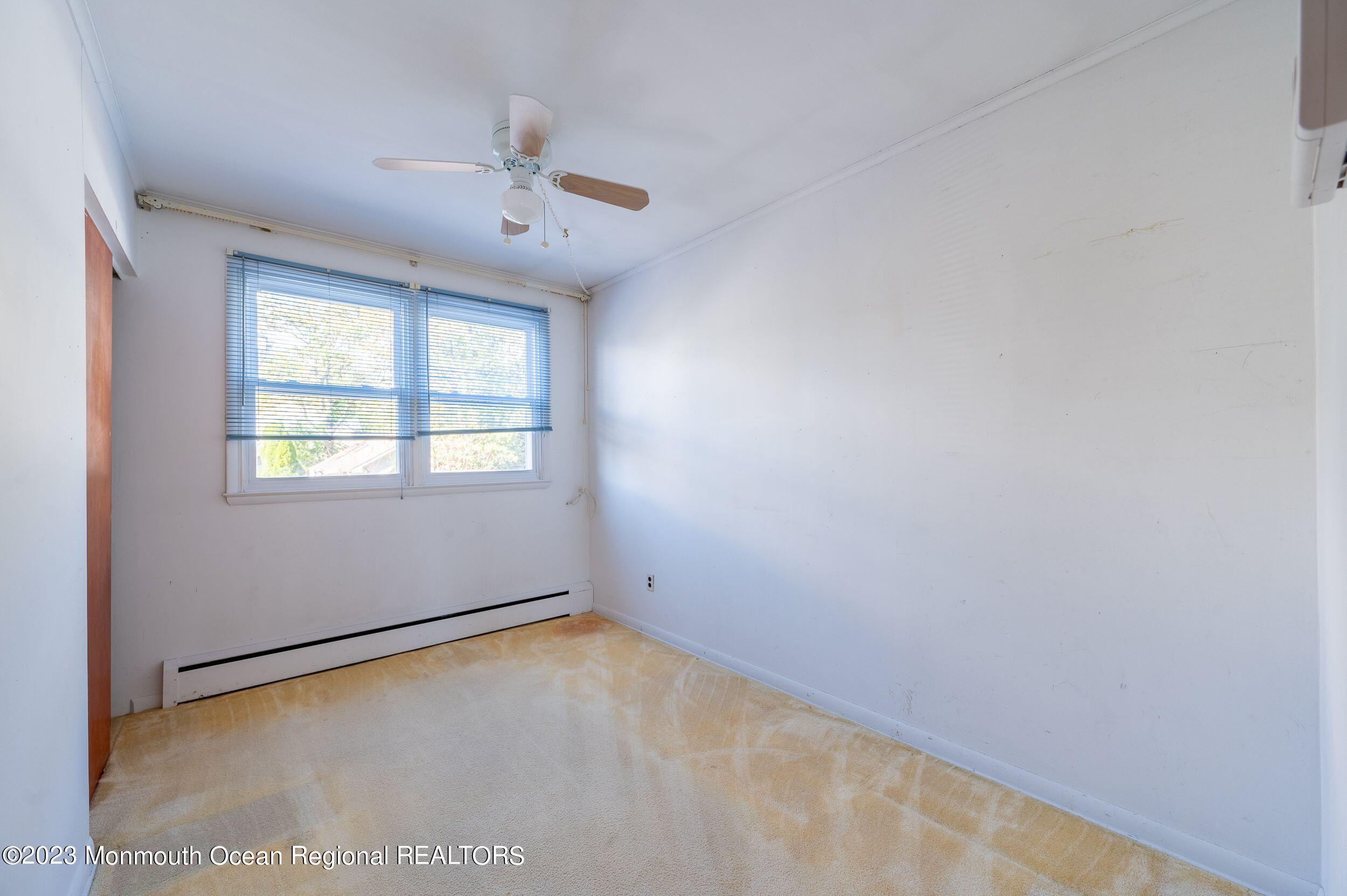 660 Pine Meadow Road Brick, NJ 08724 - Photo 30 of 67 an empty room with windows