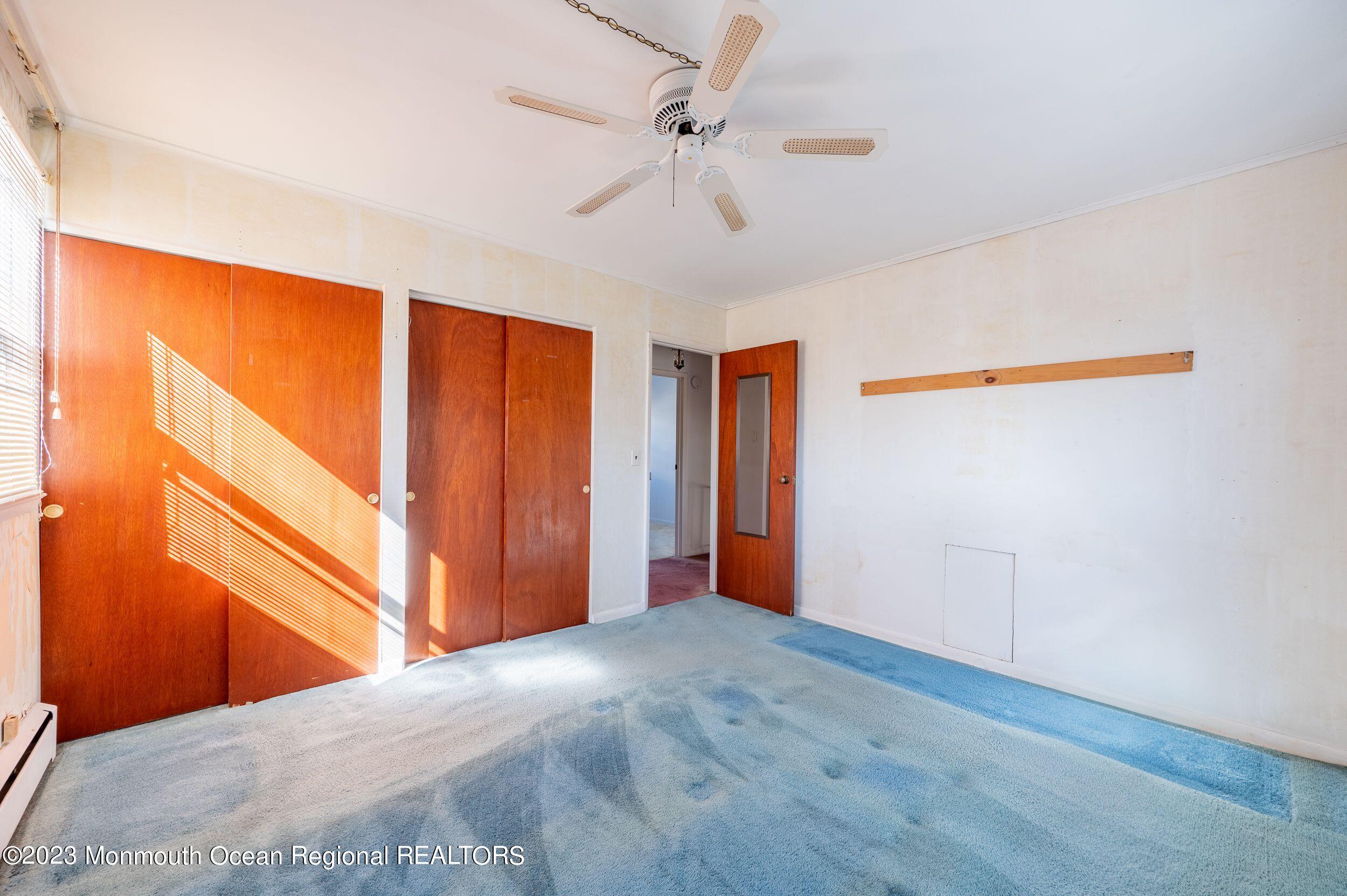 660 Pine Meadow Road Brick, NJ 08724 - Photo 34 of 67 a view of a room with wooden floor fan and windows